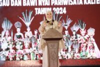 FOTO: Ketua TP PKK Provinsi Kalteng Ivo Sugianto Sabran saat menyampaikan sambutan pada acara Grand Final Jagau dan Bawi Nyai Pariwisata FBIM 2024. (FOTO: IST) 