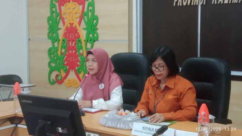 Asisten Ekbang Sri Widanarni bersama kepala BPS Kalimantan Tengah.(IST)