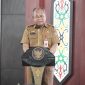 SAMBUTAN: Pelaksana Harian (Plh) Asisten Pemerintahan dan Kesejahteraan Rakyat, Sekretariat Daerah Provinsi Kalteng Maskur saat membacakan sambutan Gubernur saat Rakor Pengembangan Kabupaten dan Kota Tanggap Ancaman Narkotika yang digelar di Aula Jayang Tingang, Selasa (6/5).(IST)
