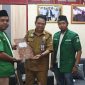 PERTEMUAN: Sekretaris DLH Kalteng, Dr. H. Noor Halim, didampingi Kasubag Umum DLH, Bintoro Junaidi, saat melakukan petemuan dengan Ketua PW GP Ansor Kalteng, Arjoni, Selasa (22/7/2025).(IST)