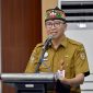 SAMBUTAN : Plt. Sekda Leonard S. Ampung saat menyampaikan Sambutan Sekaligus Membuka Acara di Aula BAPPERIDA Provinsi Kalimantan Tengah, Palangka Raya, Senin (19/1/2026).